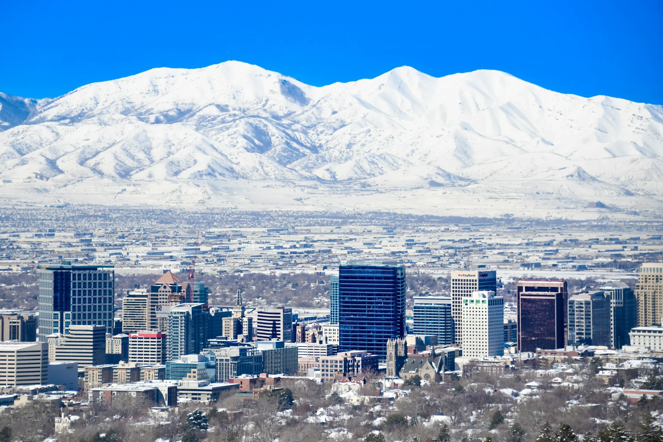 Salt Lake City skyline and snow-covered Wasatch mountains